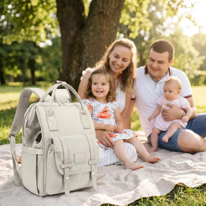 famille parc avec sac a langer