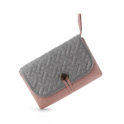 matelas a langer nomade rose debout