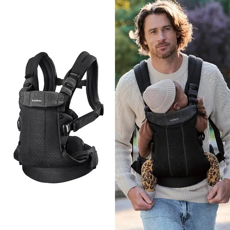 papa avec bébé dans porte bebe physio noir