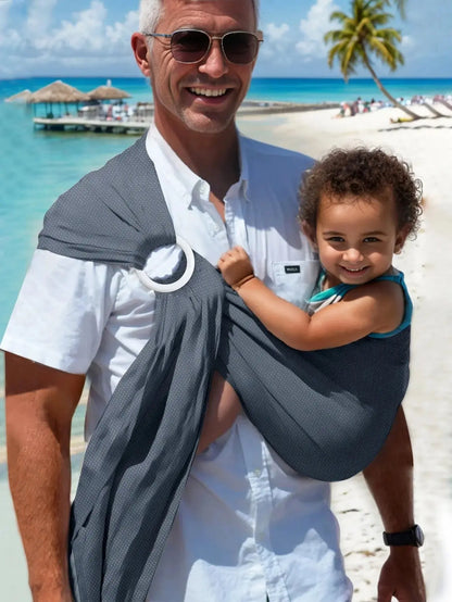 papa la plage avec bebe dans echarpe portage bebe